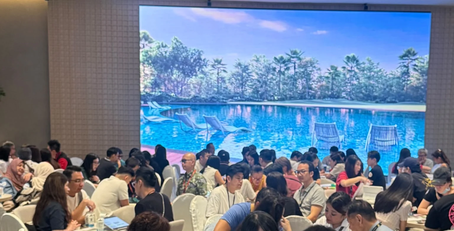 Visitors seated in discussion at the Thomson Reserve sales gallery during its opening preview weekend