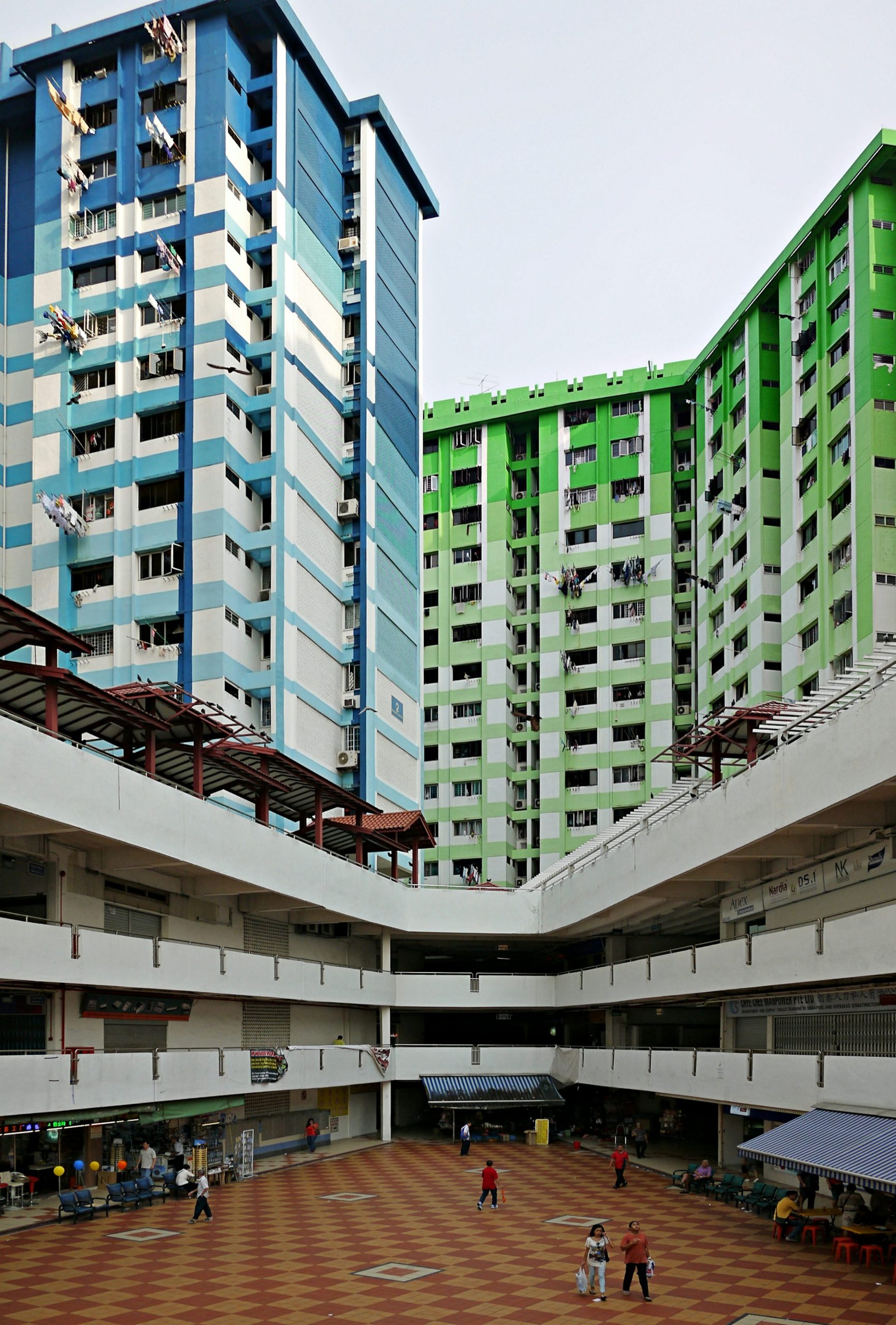 High rise residential buildings in Singapore representing condo pricing and market comparison