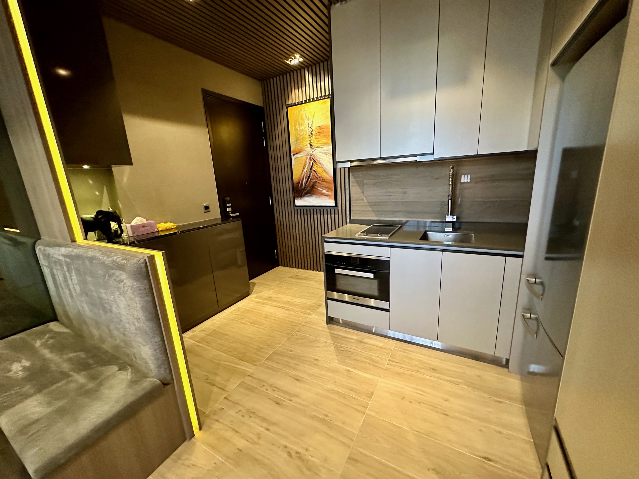 Compact renovated kitchen at The Siena with built-in cabinetry