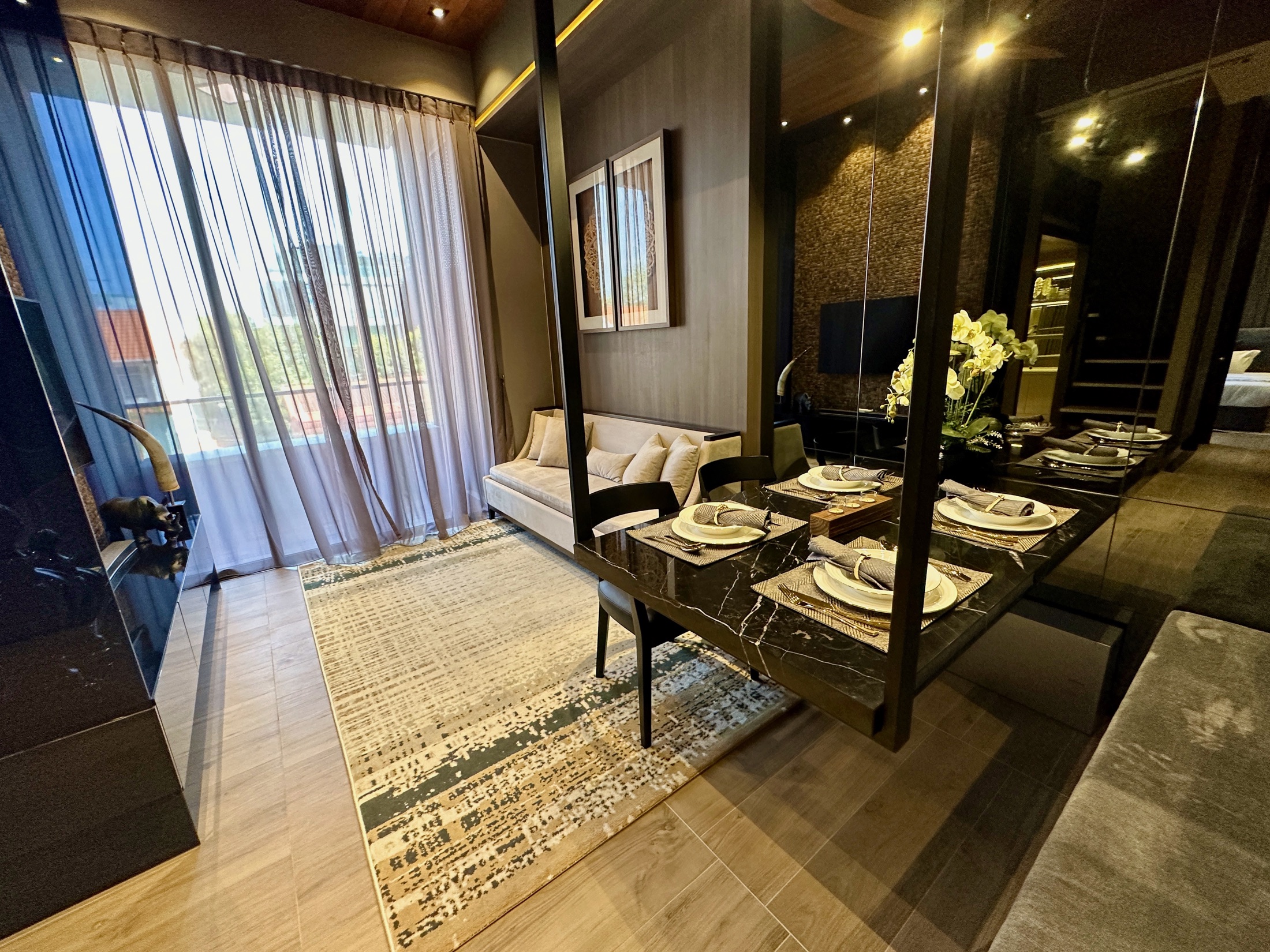 Modern renovated bathroom with glass shower screen and warm finishes