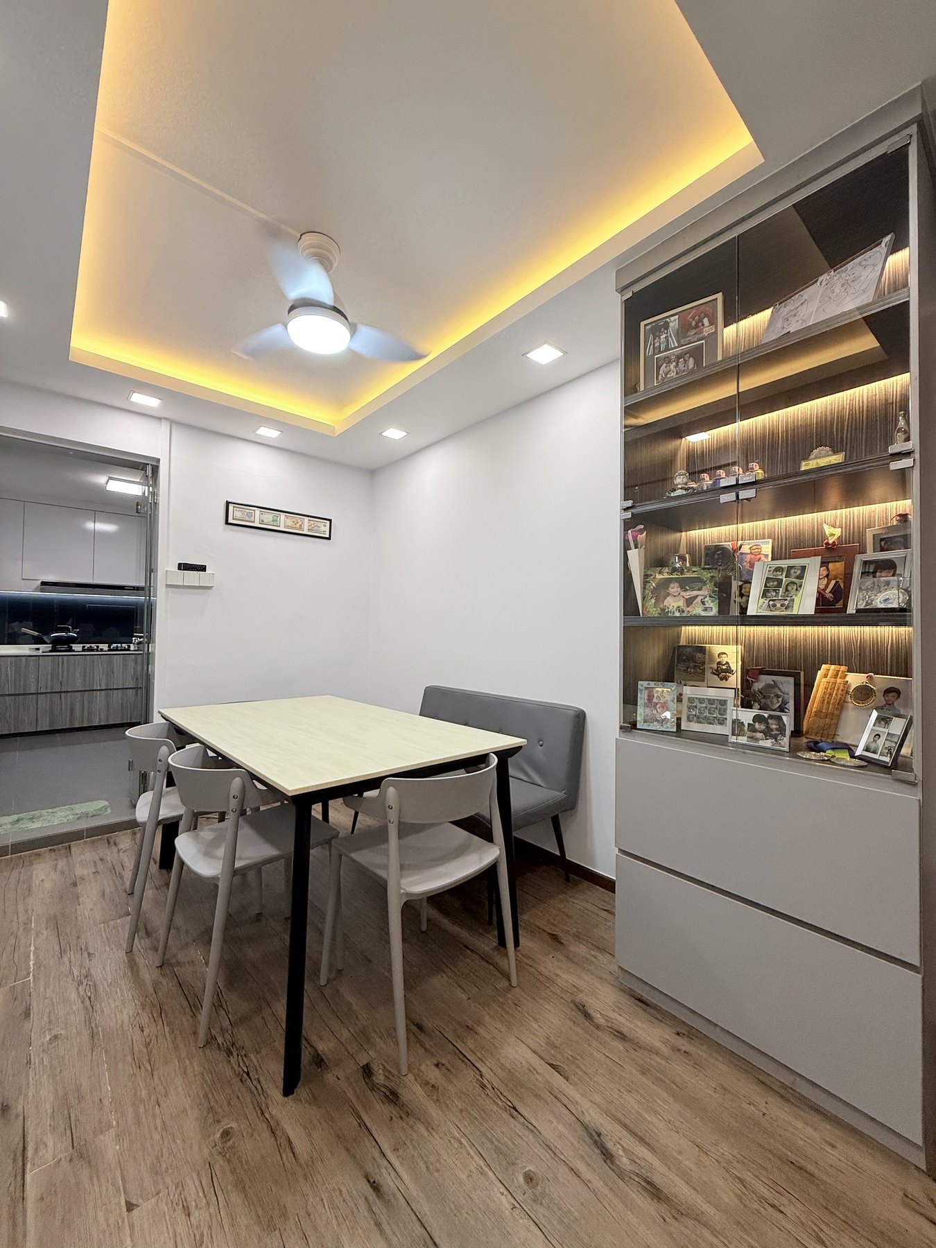 Dining area with display cabinet beside the kitchen entrance