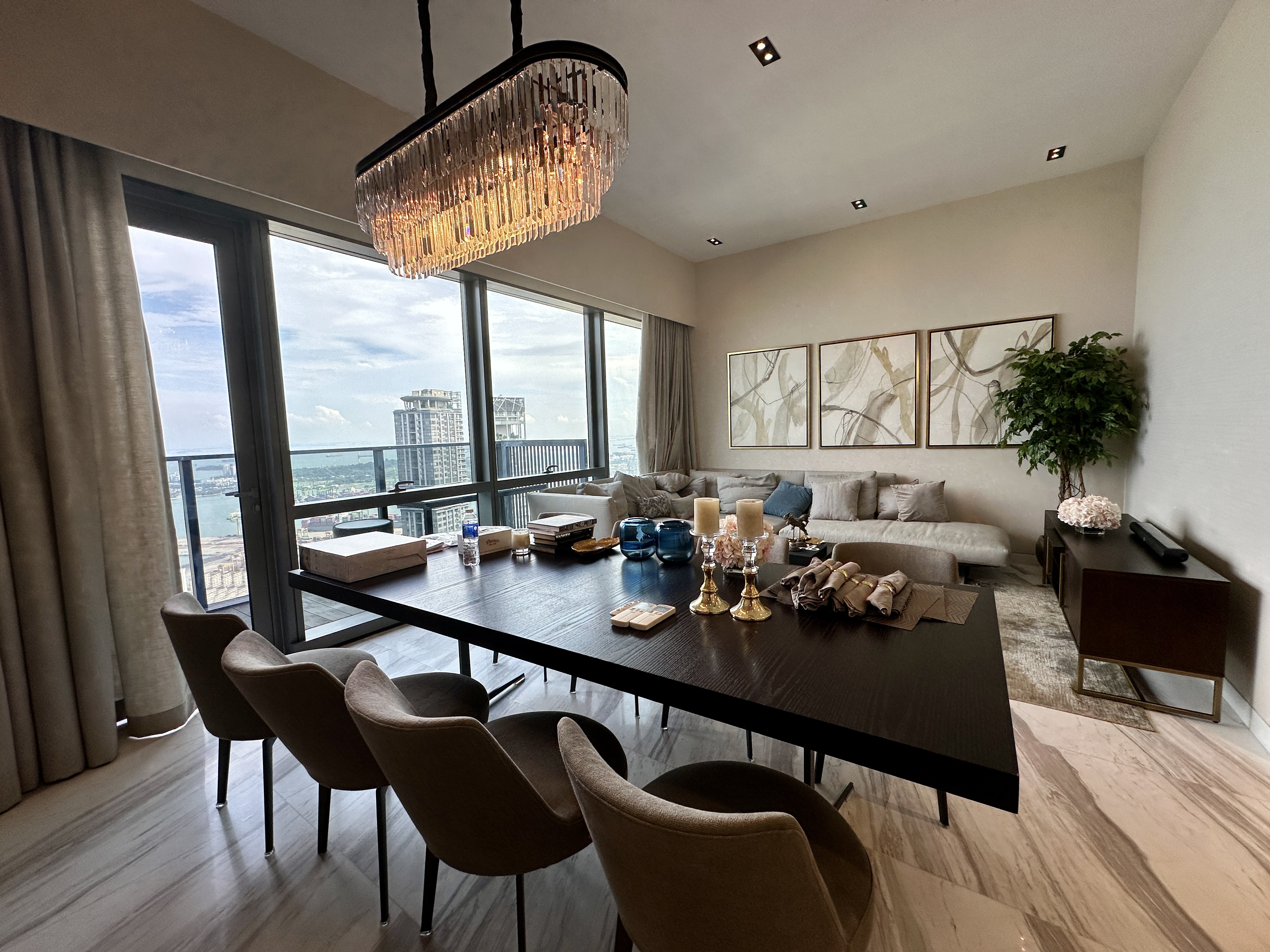 Wallich Residence living and dining area with high-floor view