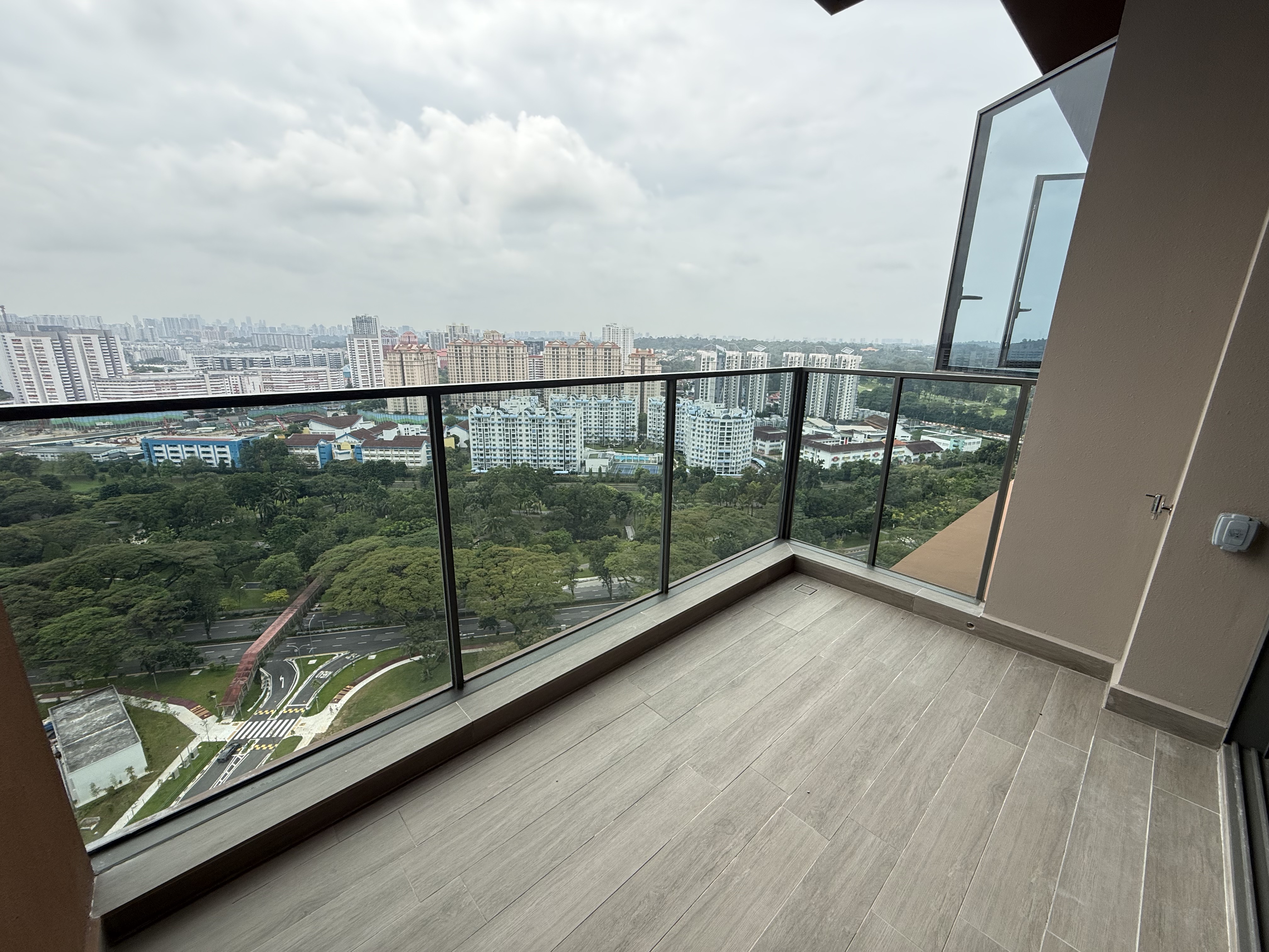 Balcony at AMO Residence overlooking the surrounding estate and greenery
