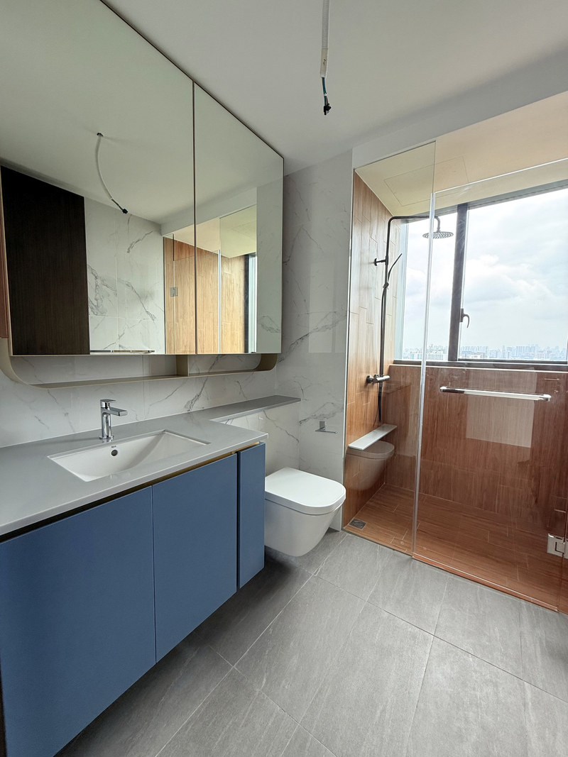 Brand new bathroom at AMO Residence with glass shower screen and vanity